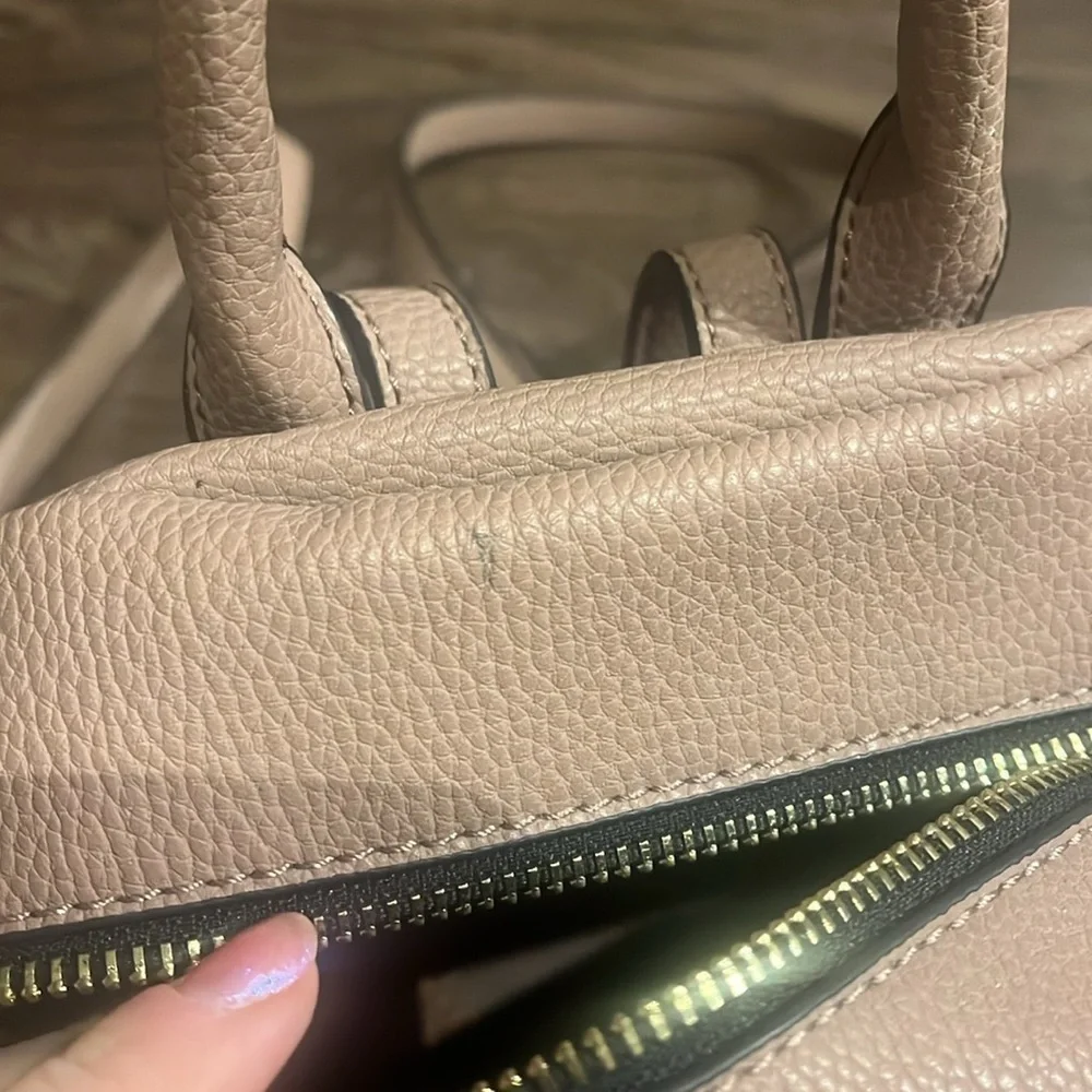 small pink faux leather backpack